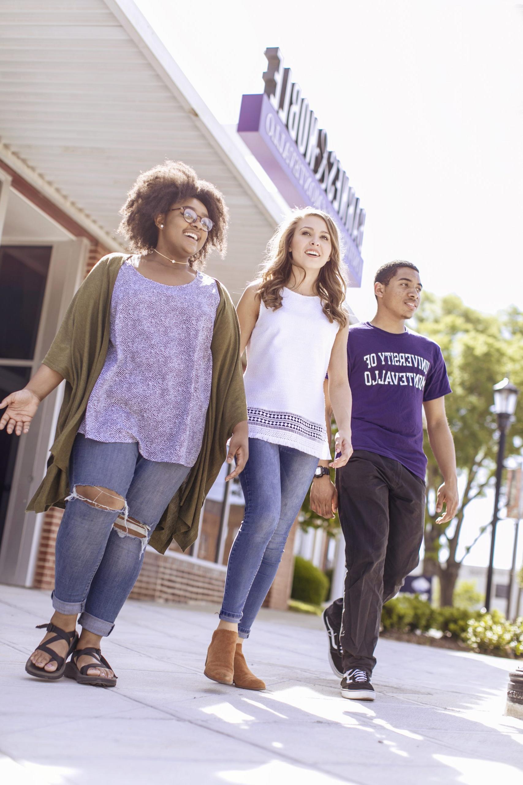 Students walking in front of UM Bookstore on Main Street.