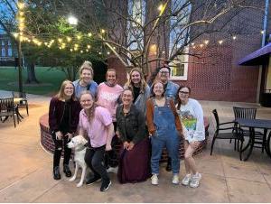 A group of English students outside Farmer Hall.